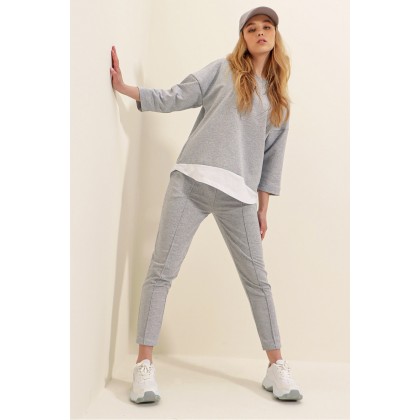 طقم قطعتين باللون السكني بلوزة وبنطلون